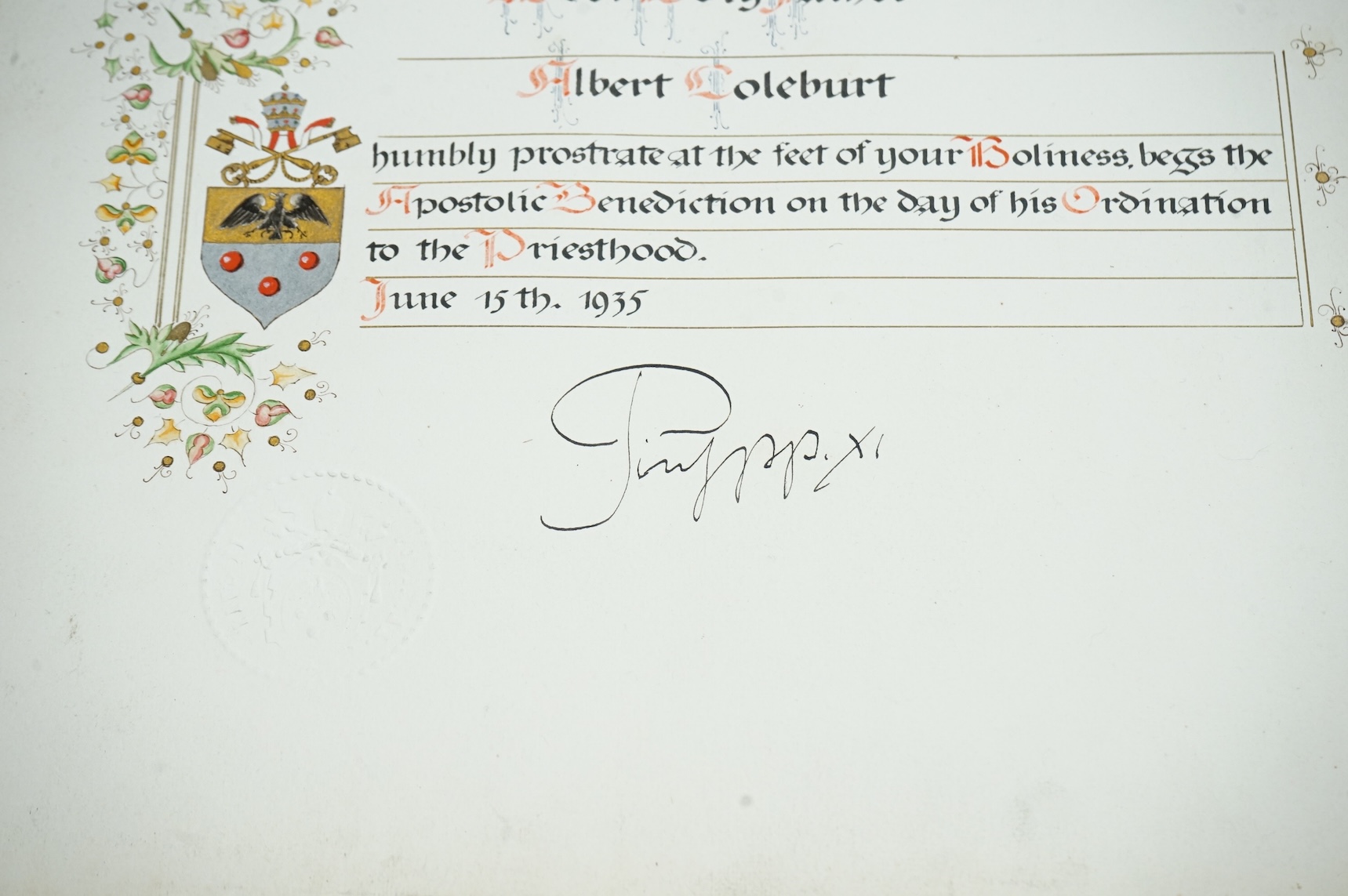 An autographed photograph of Pope Pius XI, on the celebration of the ordination of Albert Coleburt, priested on June 15th, 1935, decorated with the people coat of arms and embossed with Pius XI’s official blind stamp, 52